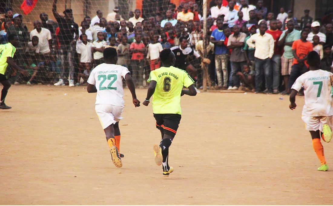 Football players taking part in a community tournament